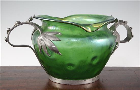 A Loetz style Art Nouveau iridescent green glass and pewter mounted bowl, c.1905, width 44cm